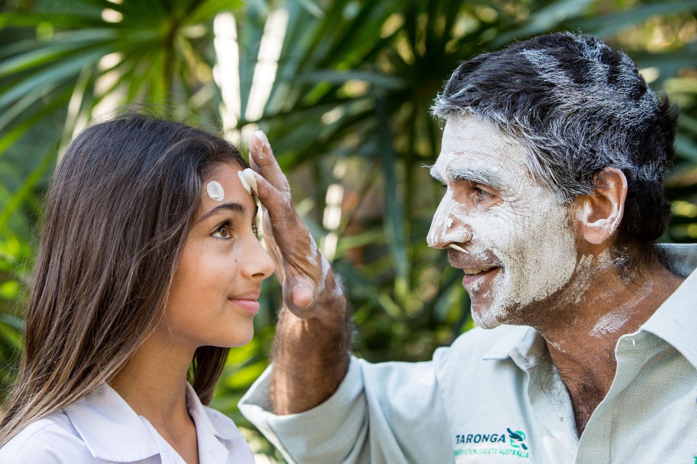 Leslie McLeod, Indigenous Guest Experience Officer with child